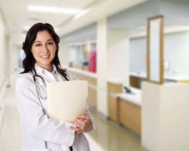 Healthcare professional reviewing a patient chart